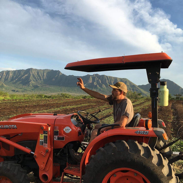 Farmer in Hawaii on a tractor 